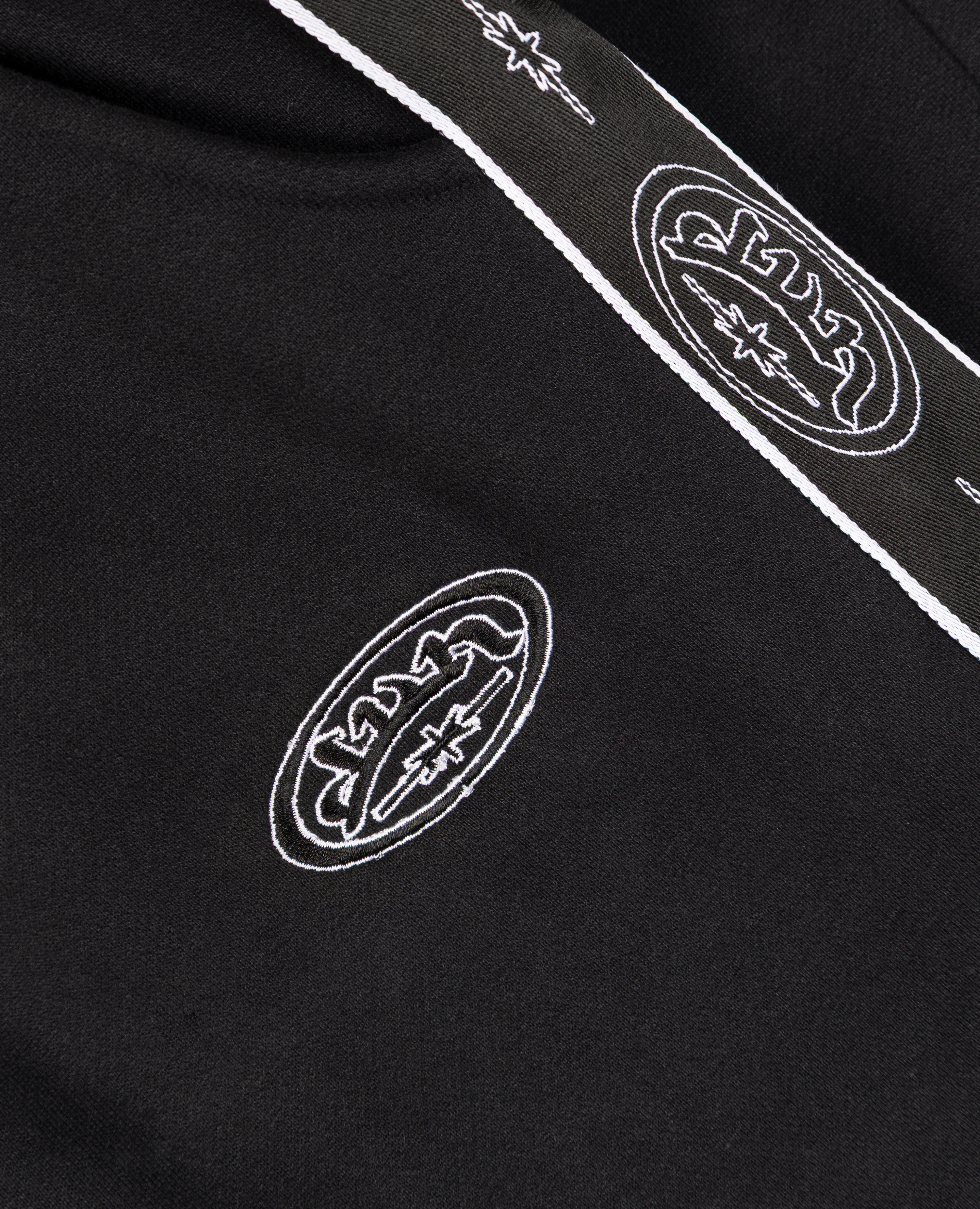 SCHWARZES SPORTSTREIFEN-T-SHIRT